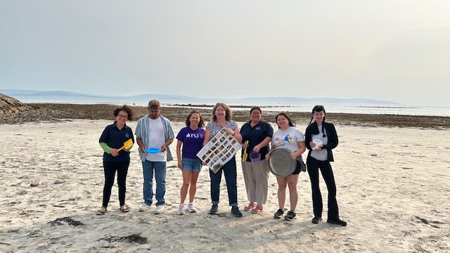 Aquarium staff with members of staff from ATU on the shore for the Microworlds Event